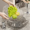 بعض شرائح الفاكهة ذات الأرجل العالية في غرف المعيشة مع وجبات خفيفة Specification image